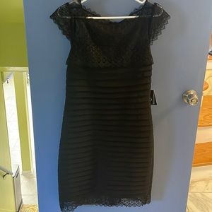 Beautiful detail cocktail dress, sure to impress. 40” long.